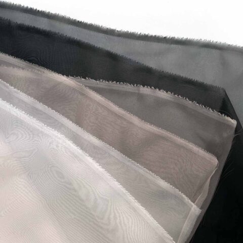 100 percent recycled plastic vegan imitation silk organza fabric in white, taupe, and black