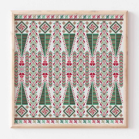 A Palestinian needlework of geometric Christmas shapes stitched in repeating columns in red and green