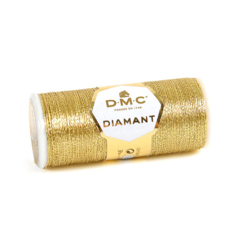 A spool of DMC Diamant Light Gold on a white background