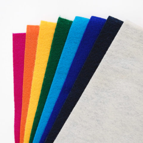 Synthetic felt sheets arranged in a rainbow fan