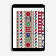 Closeup of the corner of a counted stitch pattern in red, green and blue shown on a tablet screen
