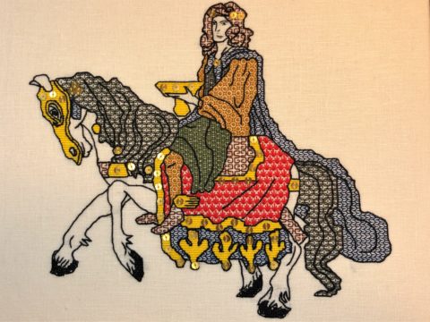 An embroidery of a long-haired man holding a golden bowl while riding on an armored horse, done in a medieval style