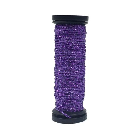 Spool of purple metallic thread on a white background