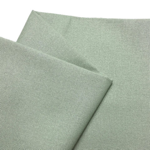 Folded grey-green fabric on a white background