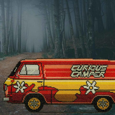 Cross-stitch of a red and yellow "curious camper" van