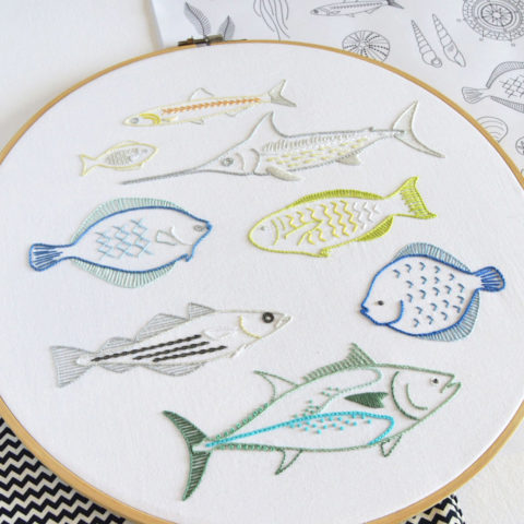 Shoal embroidery featuring anatomical fishes by Kelly Fletcher