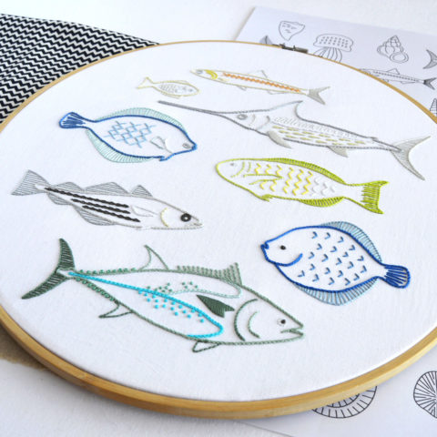 Shoal embroidery of anatomical fishes by Kelly Fletcher