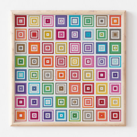 A decoelian tatreez cross stitch showing a grid of rainbow concentric squares in a wood frame