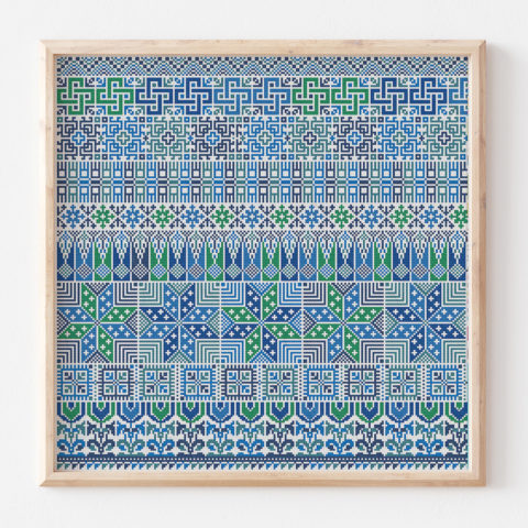 Rows of traditional Palestinian tatreez cross-stitch motifs stitched in blues and greens on white fabric