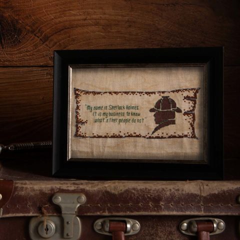 old-fashioned style cross-stitch sampler of sherlock holmes's silhouette and the words "my name is sherlock holmes and it is my business to know what other people do not