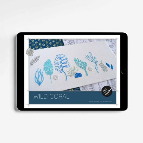 A blue and white ocean corals embroidery pattern shown on a tablet screen