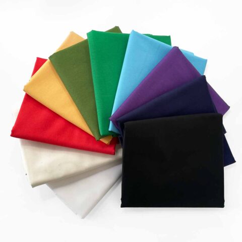 american made cotton quilting solid fabrics arranged in a rainbow fan