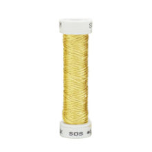 a spool of light yellow silk thread