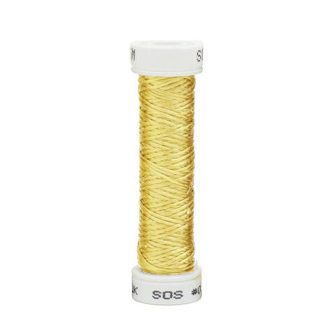 a spool of light yellow silk thread