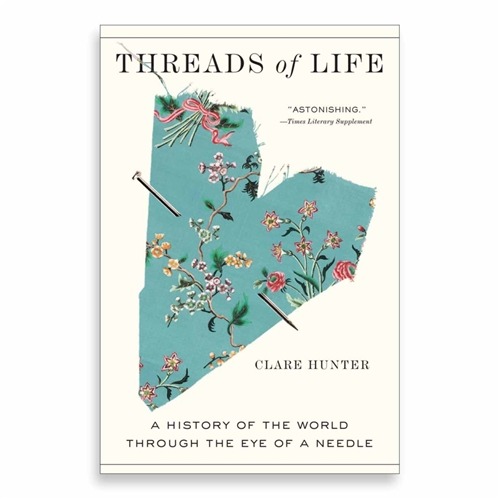 Threads of Life book cover showing floral fabric torn into a heart shape with a needle speared through it