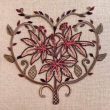 a castor bean plant embroidered on raw natural linen