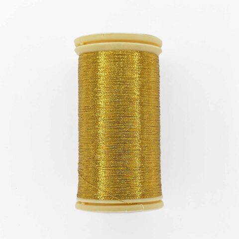 spool of sajou fil a gant au chonois waxed cotton gloving thread 120 gold metallic