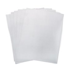 clear plastic canvas sheets fanned out on a white background