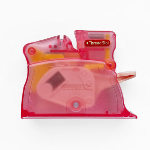 clover desktop automatic needle threader in clear pink plastic with lever