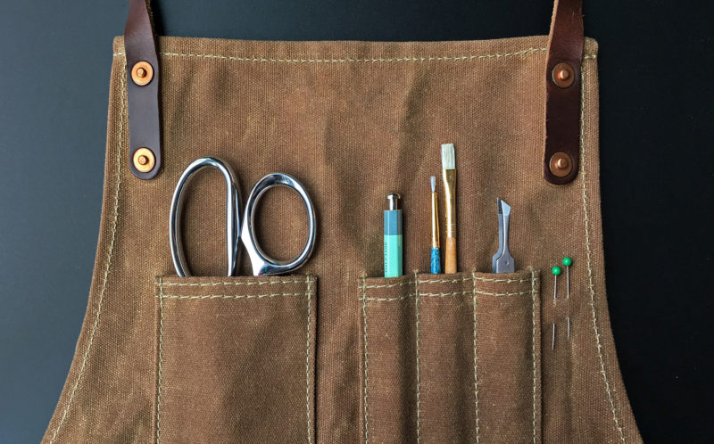 craft apron with tools in front pocket