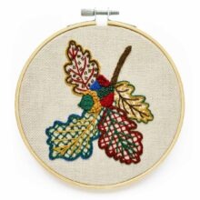 crewelwork embroidery oak sprig in primary colors