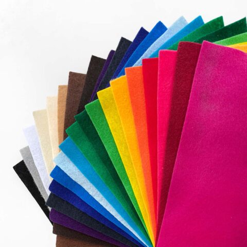 24 solid colored felt sheets arranged in a rainbow fan