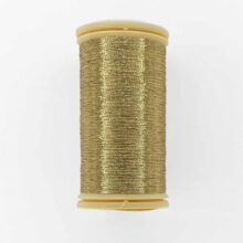 spool of sajou fil a gant au chonois waxed cotton gloving thread 102 gold metallic