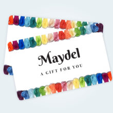 maydel gift cards showing an embroidery floss rainbow