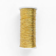 gold thread on a white spool