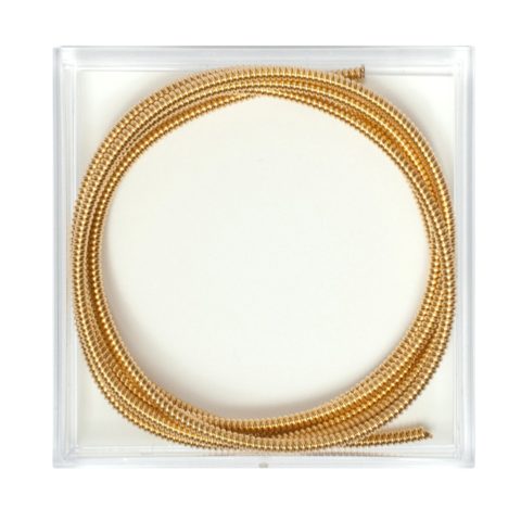 coiled gold wire in a clear plastic box