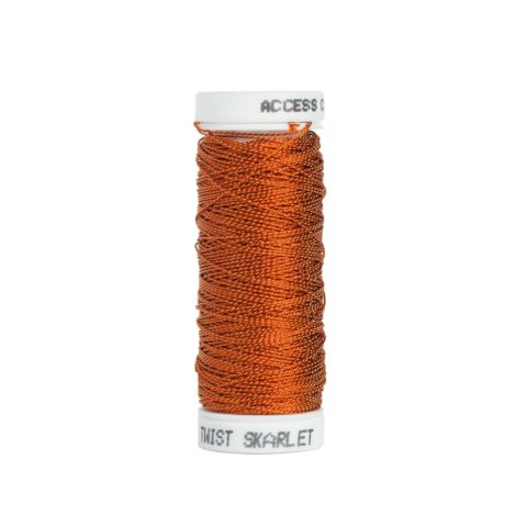 A bobbin of red and gold twisted embroidery thread on a white background