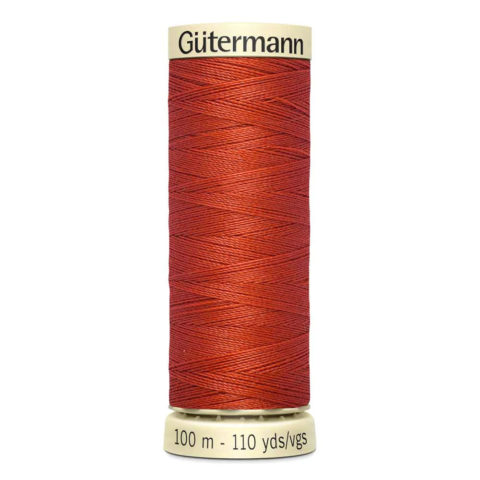 spool of gutermann cotton thread in copper