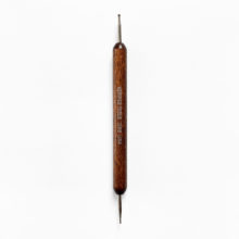 a wooden handled, double-ended ball stylus with the word "Kemper" stamped on the wood