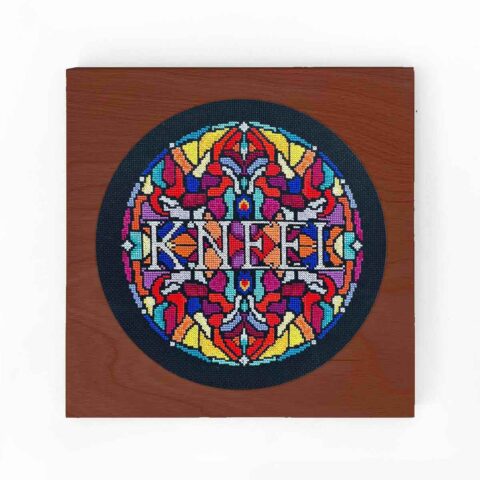 kneel stained glass cross stitch by stephxsttich in a square hoop frame wood with caramel stain finish