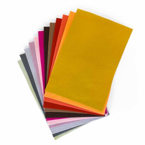 merino wool felt sheets fanned out in twelve warm colors