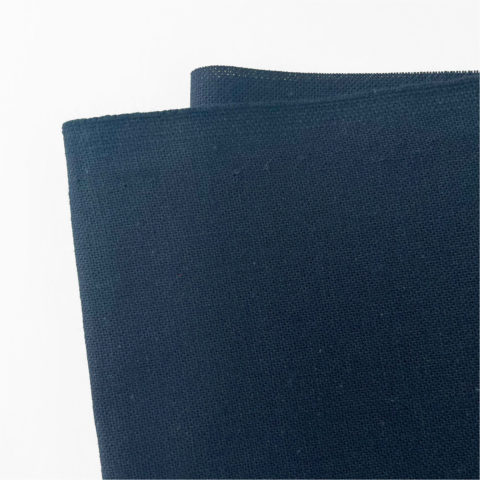 a folded piece of navy blue cotton fabric on a white background