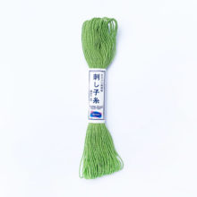 A skein of olympus sashiko cotton thread in yellowish green