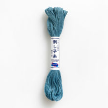 A skein of olympus sashiko cotton thread in sky blue