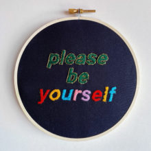 embroidery pattern composed of text that reads “Please be yourself”