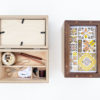 two wooden keepsake boxes with frame lids, one of which is propped open to revealed divided interior compartments