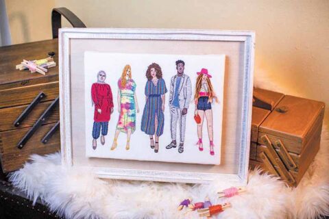 embroidered fashion plates depicting five people of various ethnicities