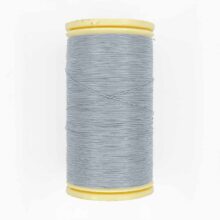 spool of sajou fil a gant au chonois waxed cotton gloving thread 120 gray grey