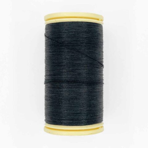 spool of sajou fil a gant au chonois waxed cotton gloving thread 180 black