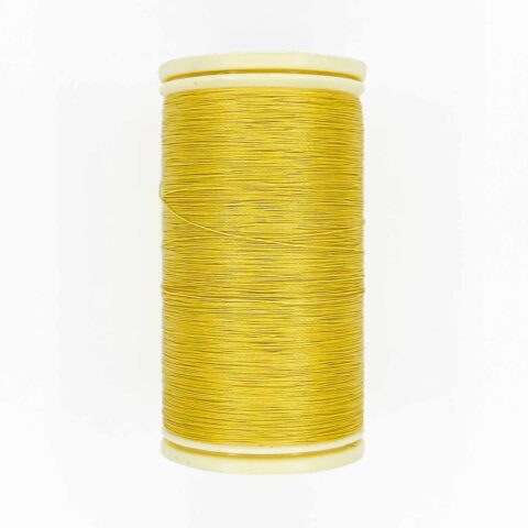 spool of sajou fil a gant au chonois waxed cotton gloving thread 334 corn