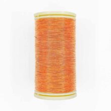 spool of sajou fil a gant au chonois waxed cotton gloving thread 390 orange