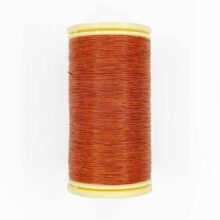 spool of sajou fil a gant au chonois waxed cotton gloving thread 442 mahogany