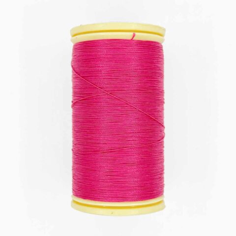 spool of sajou fil a gant au chonois waxed cotton gloving thread 501 fuchsia
