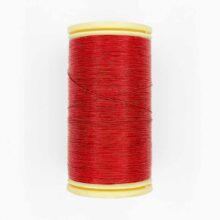 spool of sajou fil a gant au chonois waxed cotton gloving thread 525 red