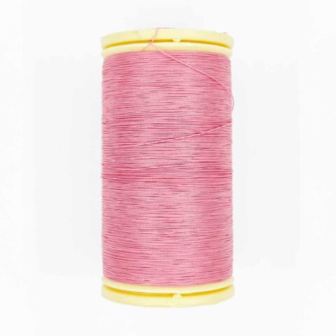 spool of sajou fil a gant au chonois waxed cotton gloving thread 594 pink