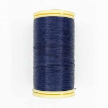 spool of sajou fil a gant au chonois waxed cotton gloving thread 650 navy
